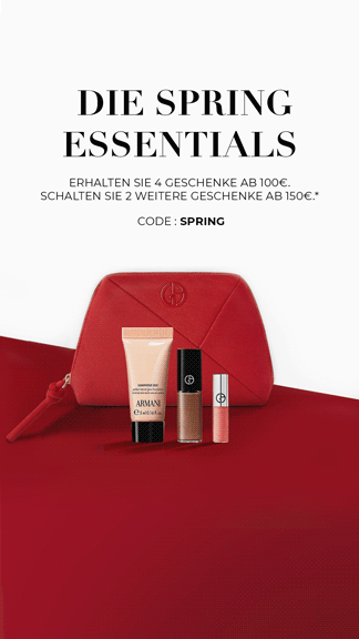 Armani Code Elixir fragrance bottle on a black leather background.