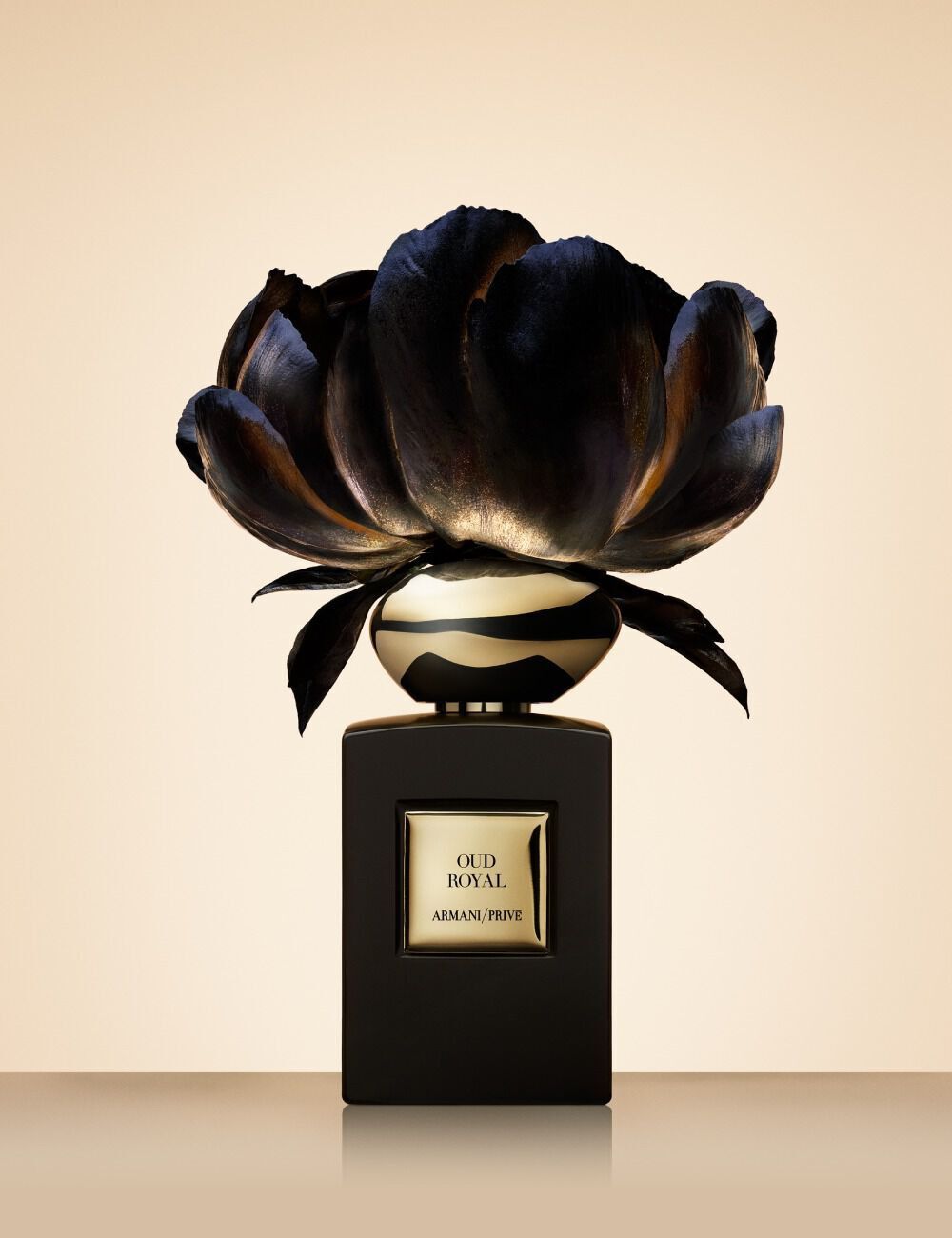 Armani/Prive Oud Royal: perfume bottle crowned with a dramatic metallic flower.