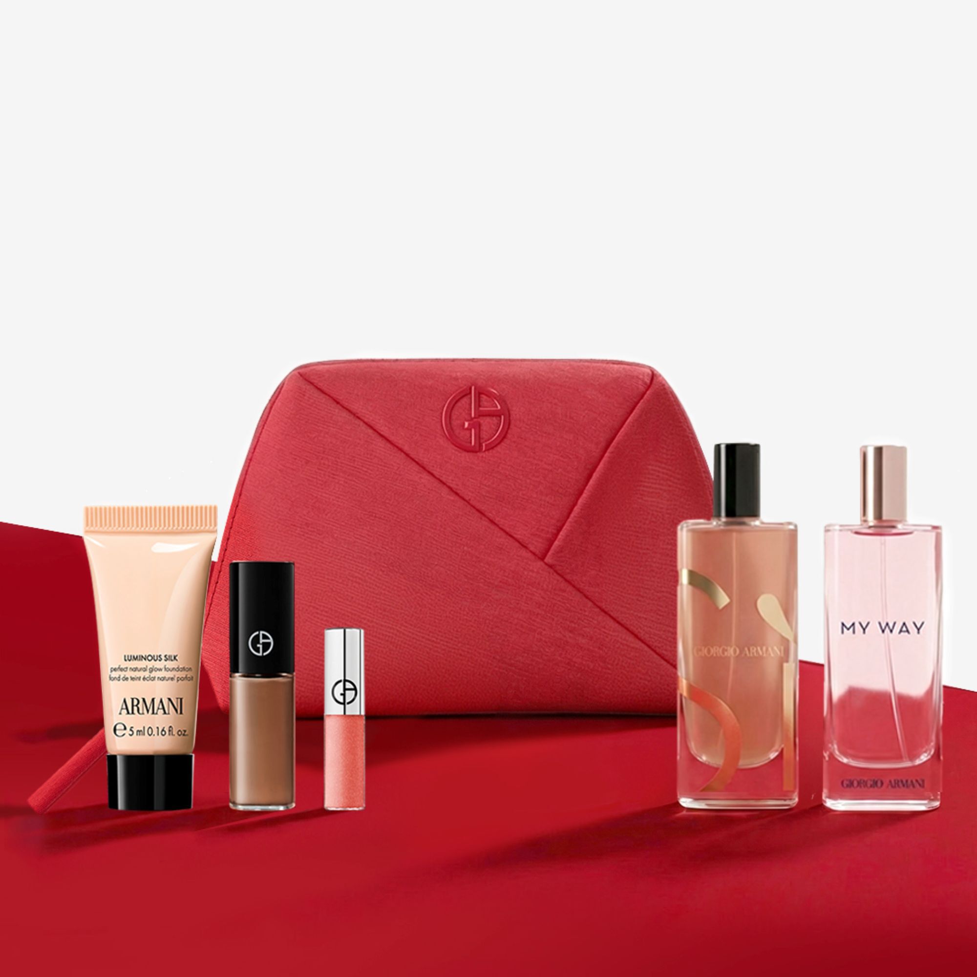 Giorgio Armani Beauty-Set mit roter Tasche, Parfums und Make-up.
