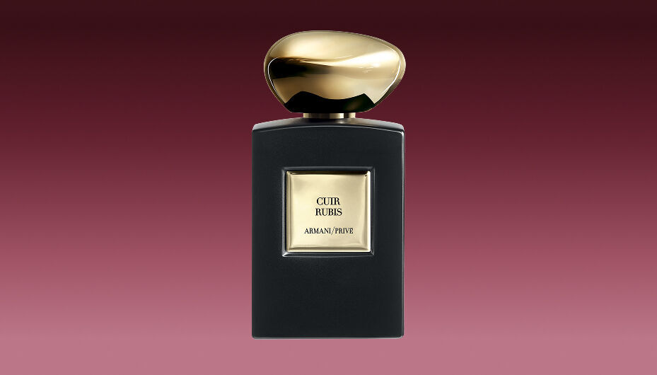 Armani/Prive Cuir Rubis fragrance bottle with matte black finish and precious golden cap.